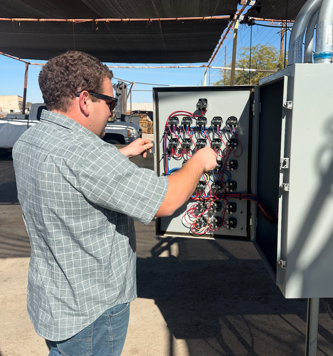 Charlie Babb - Brawley electrician working on electrical panel